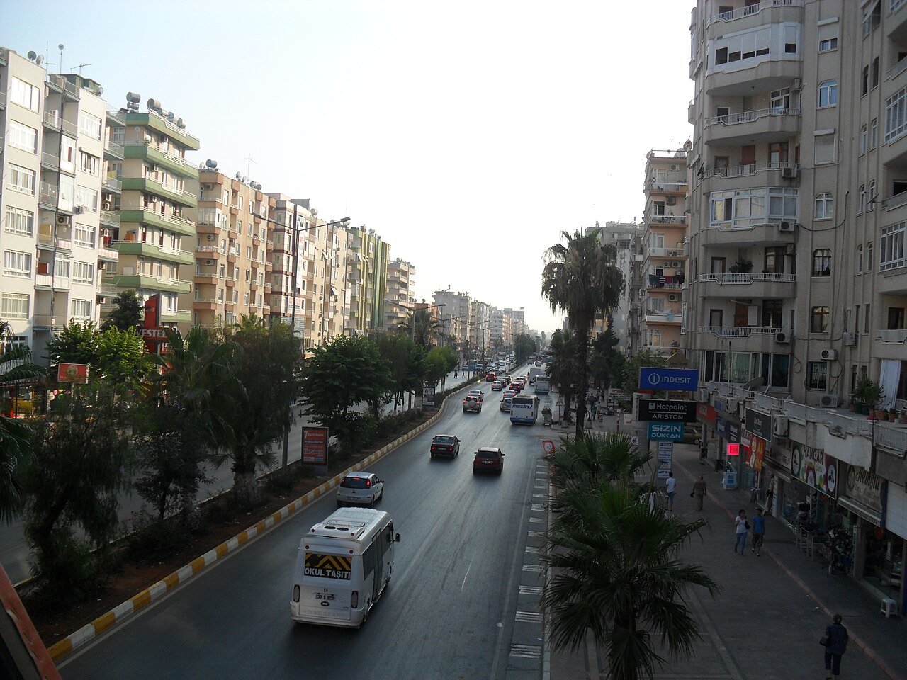 Gazi Mustafa Kemal Boulevard in Mersin with apartment buildings and palm trees
